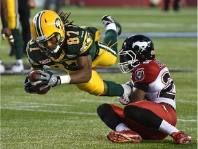 Edmonton Eskimos rookie receiver Derel Walker dives for extra yardage after making a catch against the Calgary Stampeders during the CFL's West Division final at Commonwealth Stadium on Nov. 22, 2015.