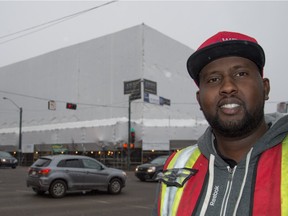 Quickwrap's Lee Geyd and the shrink-wrapped office building at the corner of 124th St. and Stony Plain Rd. in Edmonton.