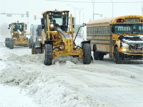 Graders on 99 St. after 10-15 cm of snow fell overnight in Edmonton on Nov. 24, 2015.