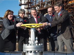 Alberta Energy Minister Marg McCuaig-Boyd, Shell Canada president Lorraine Mitchelmore, 
Royal Dutch Shell chief executive Ben van Beurden, Marathon Oil Canada president Brian Maynard, and Chevron Canada president Jeff Gustavson open a ceremonial valve at the official opening Friday of Quest carbon capture and storage project.