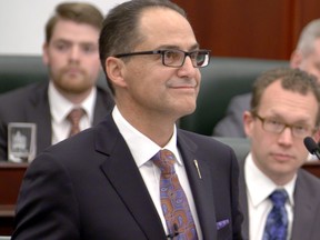 Finance Minister Joe Ceci reads the NDP's 2015 Alberta budget at the Alberta Legislature in Edmonton on October 27, 2015.