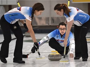 Sweepers Rachelle Brown, left, and Dana Ferguson get ready to sweep skip Val Sweeting's shot in the HDF Insurance Shoot-Out bonspiel final at the Saville Community Sports Centre on Sept. 20, 2015.