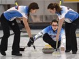 Sweepers Rachelle Brown, left, and Dana Ferguson get ready to sweep skip Val Sweeting's shot in the HDF Insurance Shoot-Out bonspiel final at the Saville Community Sports Centre on Sept. 20, 2015.