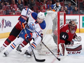 GLENDALE, AZ - NOVEMBER 12:  Leon Draisaitl #29 of the Edmonton Oilers attempts a wrap around on goaltender Mike Smith #41 of the Arizona Coyotes during the second period of the NHL game at Gila River Arena on November 12, 2015 in Glendale, Arizona.