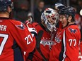 Washington Capitals goalie Braden Holtby (70) and teammate T.J. Oshie (77) celebrate after defeating the Edmonton Oilers 1-0 at the Verizon Center on Nov. 23, 2015 in Washington, D.C.