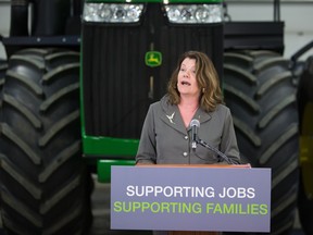 Lori Sigurdson, minister of Jobs, Skills, Training and Labour speaks to media about proposed changes to ensure farm and ranch workers are kept safe on the job at the Kalco grain farm near Gibbons on Nov. 17, 2015.