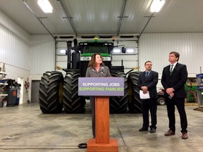 Lori Sigurdson, Minister of Jobs, Skills, Training and Labour, speaks to media about proposed changes to ensure farm and ranch workers are kept safe on the job. This photo was taken at the Kalco grain farm near Gibbons on Nov. 17, 2015.