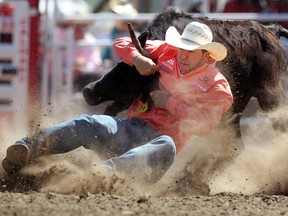 Steer wrestler Morgan Grant from Granton, Ont., competes at the Calgary Stampede on July 11, 2014. Grant is the only person who qualified for two events at the 2015 Canadian Finals Rodeo.