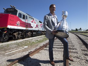 On Aug. 29, 2012, CFL Commissioner Mark Cohon hoists the Grey Cup in front of a train in Toronto that went on to tour the trophy across Canada to mark its 100th anniversary. The Grey Cup Special train was a Canadian institution for years.