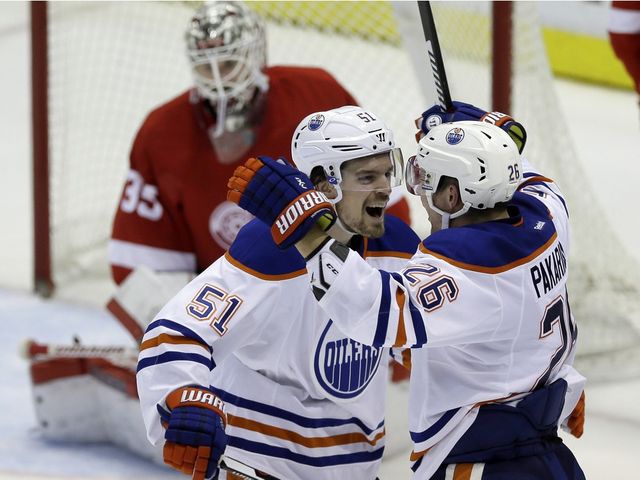 Edmonton Oilers centre Anton Lander (51) and right wing Iiro Pakarinen (26) celebrate Pakarinen's goal during the third period against the Detroit Red Wings, Friday, Nov. 27, 2015, in Detroit.