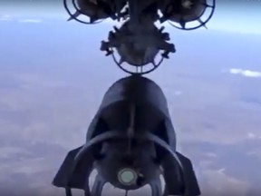 In this photo made from the footage taken from Russian Defense Ministry official website on Tuesday, Nov. 17, 2015, a Russian bomber drops bombs on a target in Syria.