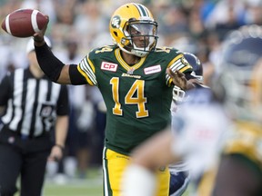 Edmonton Eskimos quarterback James Franklin (14) makes the pass against the Toronto Argonauts during first half action in Edmonton, Alta., on Friday August 28, 2015.