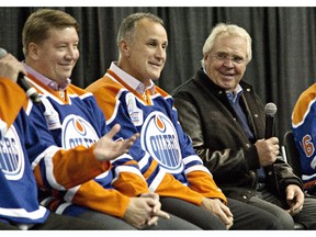 Jari Kurri, left, Paul Coffey and Glen Sather listen to teammates tell stories during the 1984 Stanley Cup Reunion Introductory Media Availability in Edmonton, Alta., on Wednesday, Oct, 8, 2014.The Edmonton Oilers will raise a banner at Rexall Place to honour former coach, general manager and executive Sather.