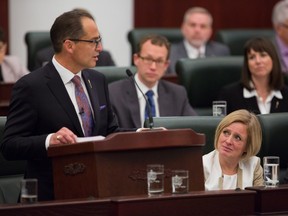 Alberta Premier Rachel Notley, right, looks on as Finance Minister Joe Ceci presents the release of the 2015 provincial budget to the Legislative Assembly on Oct. 27, 2015.