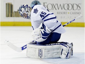 Toronto Maple Leafs goalie Jonathan Bernier reacts after realizing that a shot by New York Rangers' Derek Stepan from the middle of the ice has slid past him during the second period of an NHL hockey game, Sunday, Nov. 15, 2015, in New York.