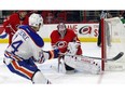Edmonton Oilers' Jordan Eberle (14) has his shot blocked by Carolina Hurricanes goalie Cam Ward (30) during the first period of an NHL hockey game, Wednesday, Nov. 25, 2015, in Raleigh, N.C.