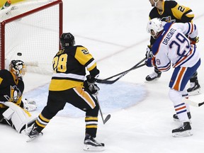 Edmonton Oilers' Leon Draisaitl (29) puts the puck behind Pittsburgh Penguins goalie Jeff Zatkoff (37) for a goal during the first period of an NHL hockey game against the Pittsburgh Penguins in Pittsburgh, Saturday, Nov. 28, 2015.