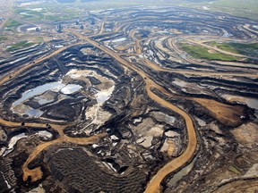 An aerial view of Canadian Natural Resources Limited (CNRL) oilsands mining operation near Fort McKay, Alta. on June 18, 2013.