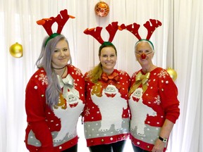 Marissa Farkas, Kerri Farkas and Beverley Farkas wear their silliest Christmas sweaters to the Christmas in November Welcome Reception at Jasper Park Lodge on Monday, Nov. 9, 2015.