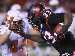 Calgary Stampeders running back Jerome Messam runs the ball against B.C. Lions linebacker Adam Bighill in last weekend's West Division semifinal at McMahon Stadium. The Edmonton Eskimos will be keying on Messam during Sunday's Western Division final.