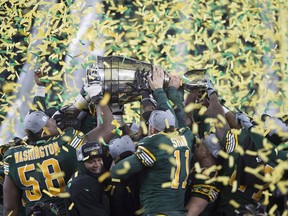 Members of the Edmonton Eskimos celebrate after defeating Ottawa Redblacks to win the 103rd Grey Cup in Winnipeg on Sunday, Nov. 29, 2015.