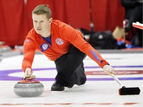 Mick Lizmore in action at the Boston Pizza Cup Alberta men's curling championship at the Peace Memorial Multiplex in Wainwright on Feb. 5, 2015.