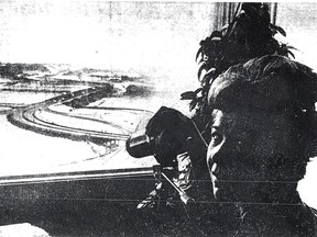 Mrs. H.E. Mildon and her telescope overlooking the river valle and Groat Road Bridge