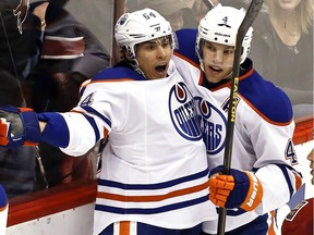 Oilers forwards Nail Yakupov, left, and Taylor Hall struggled in 2014-15, but both are now playing more fundamentally sound hockey in their own zone.