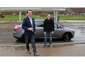 Ontario MPP Tim Hudak, left, steps out of an Uber vehicle in Niagara Falls on Nov. 12, 2015. He was the first Uber passenger in Niagara, while Justin Burrows was the first driver.