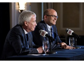 Edmonton Oilers CEO Bob Nicholson, left, and new President and General Manager Peter Chiarelli speak during a press conference in Edmonton, Alta., on Friday April 24, 2015.