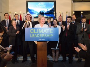 Premier Rachel Notley unveils Alberta's climate strategy in Edmonton Sunday and was flanked by representatives from industry, First Nations and environmental groups.