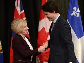 Prime Minister Justin Trudeau welcomes Alberta Premier Rachel Notley to the First Ministers meeting at the Canadian Museum of Nature in Ottawa on Monday, Nov. 23, 2015.