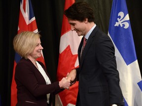 Prime Minister Justin Trudeau welcomes Alberta Premier Rachel Notley to the First Ministers meeting at the Canadian Museum of Nature in Ottawa on Monday, Nov. 23, 2015.