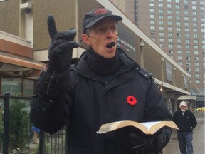 One of Edmonton's amplified street preachers spreads his message in front of downtown public library