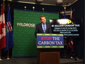 Wildrose Leader Brian Jean said Monday, Nov. 23, 2015 that a new economy-wide carbon tax proposed by the NDP government will hit struggling Albertans hard as their transportation and heating costs climb over the next two years.