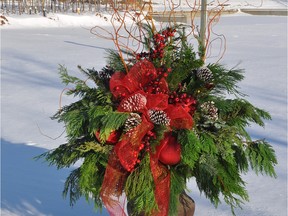 A decorative Christmas container can add a personal touch and some festive colour to your front entrance.