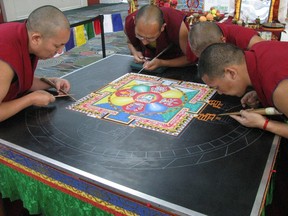 Buddhist monks work on a sand mandala at the Parliament of World's Religions in Salt Lake City in October.