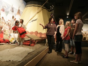 Patrons take a tour of  the group aboriginal gallery at the Royal Alberta Museum, which is celebrating its upcoming move with a weekend-long party Friday, Dec. 4 to Sunday, Dec. 6.