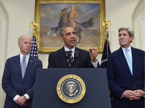 US President Barack Obama speaks on the Keystone XL pipeline, flanked by Secretary of State John Kerry, right, and Vice President Joe Biden, on November 6, 2015. Obama blocked the construction of a controversial Keystone XL oil pipeline between Canada and the United States.