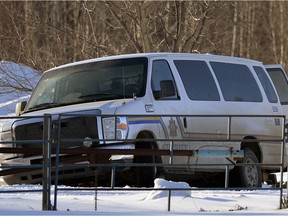 A Sheriff's van sits in a yard off Highway 33 southwest of Whitecourt, Alberta. Two men assaulted and shot two Alberta sheriffs at the courthouse in Whitecourt, Alberta on February 26, 2013.