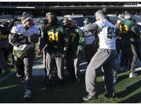 Edmonton Eskimos dance during a team practice Saturday in Winnipeg. The Edmonton Eskimos will play the Ottawa Redblacks in the 103rd Grey Cup Sunday.