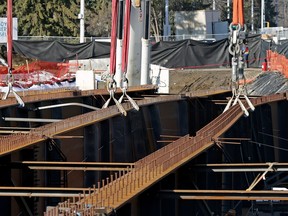 Several steel girders that twisted during installation of the 102 Avenue bridge over Groat Road in March 2015. The development company that owns High Street is seeking compensation for its tenants for all the sales lost between Oct. 1st, when the bridge was supposed to open, and the date when it finally does.