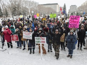 A crowd rallies against Bill 6 at the legislature on Tuesday Dec. 15, 2015.
