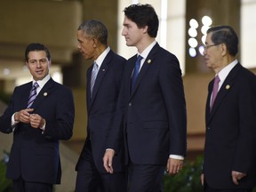 Prime Minister Justin Trudeau with President Barack Obama, Mexico's President Enrique Pena Nieto, left, and Taiwan's envoy Vincent Siew at the Asia-Pacific Economic Cooperation summit in Manila, Philippines Nov. 19.