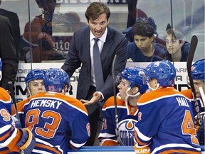 Edmonton Oilers head coach Dallas Eakins talks to his players while playing the New York Rangers NHL action in Edmonton on Sept. 24, 2013.