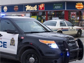 Edmonton Police Service officers investigated a fatal shooting during an armed robbery at a Mac's store at 108th Street and 61st Avenue in Edmonton, Alta., on Friday December 18, 2015.