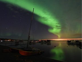 Aurora borealis shimmers across the sky above Lake Wabamun