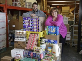 Bruno Sarnelli, warehouse manager, Italian Centre Shop, and Teresa Spinelli with a palette of food going to the E4C lunch program.