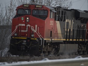 A report says a 2014 CN freight train derailment in northern Alberta was linked to track condition and increased rail traffic.