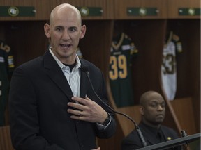 The Eskimos new head coach Jason Maas (left) speaks to the media after being introduced by Edmonton's general manager Ed Hervey (right) at Commonwealth Stadium on Dec. 14, 2015.
